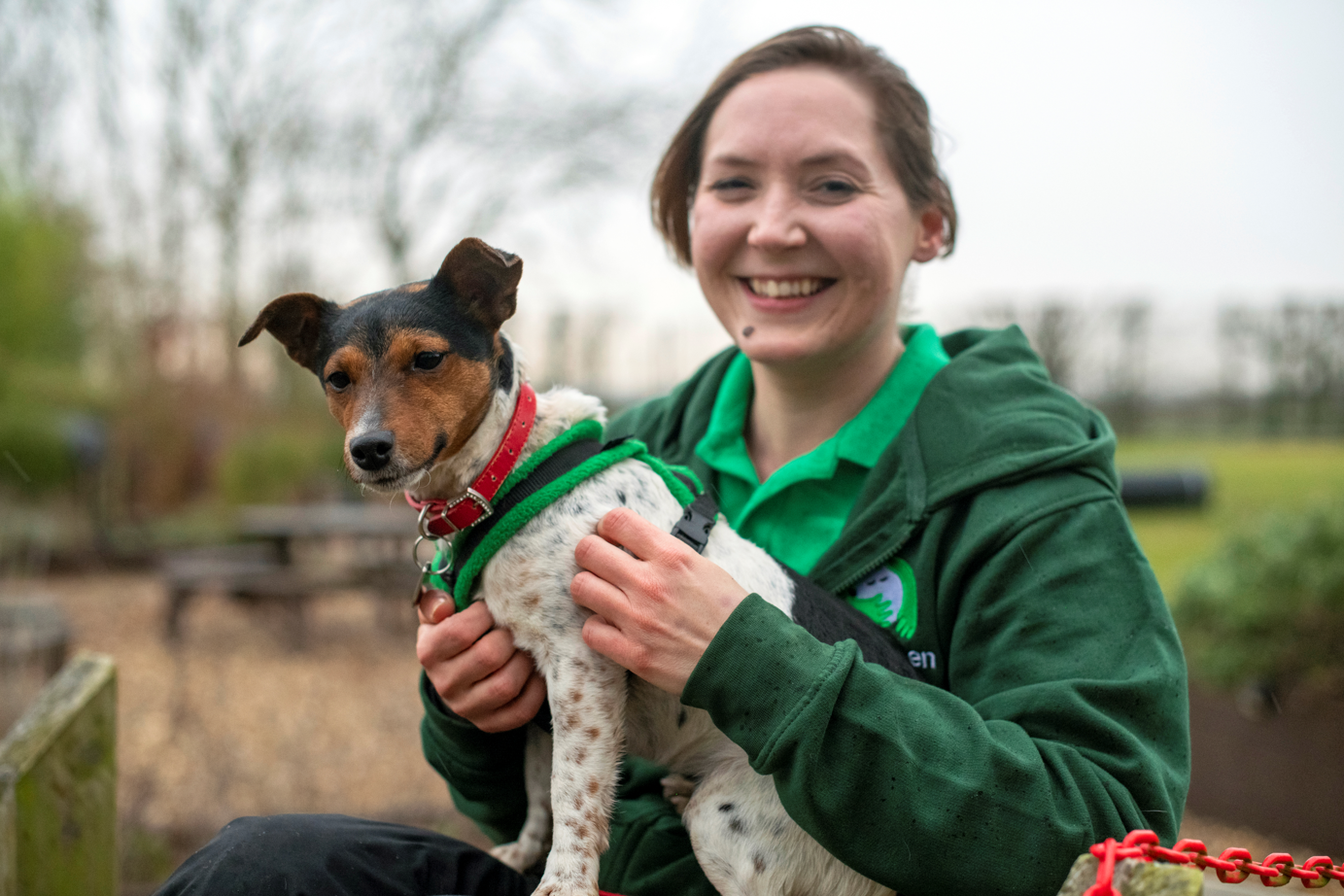 Woodgreen dog with team member.